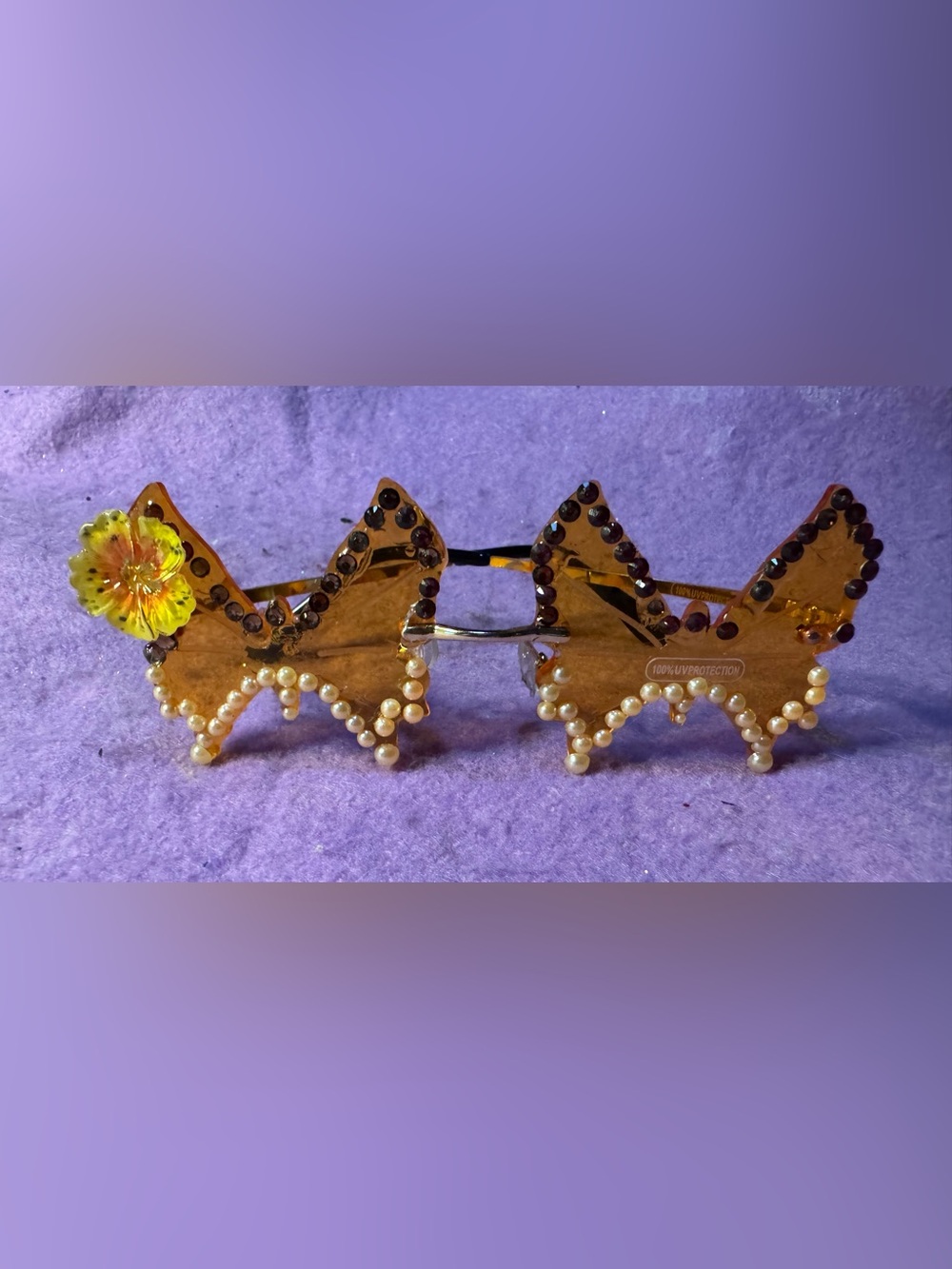 Gem-Accented Gold bow shaped Sunglasses with flower charm